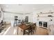 Bright open kitchen with white cabinets, stainless steel appliances, and a large island with barstool seating at 10415 Andele Ave, Las Vegas, NV 89166