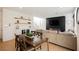 Open-concept living and dining area with modern decor, fireplace, and comfortable seating at 10415 Andele Ave, Las Vegas, NV 89166