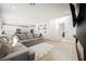 Open-concept living area with a modern fireplace and seamless flow to the kitchen at 10415 Andele Ave, Las Vegas, NV 89166