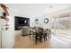 Open living space with seamless flow between the living room, dining area, and backyard at 10415 Andele Ave, Las Vegas, NV 89166