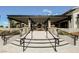The covered outdoor patio features a dining area and relaxing lounge area perfect for entertaining guests at 10415 Andele Ave, Las Vegas, NV 89166