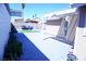 Spacious backyard featuring a covered patio area and ample space for outdoor activities and relaxation at 115 Parrish Ln, Las Vegas, NV 89110