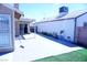 Concrete patio offers an outdoor space with decorative plants and potential for entertaining at 115 Parrish Ln, Las Vegas, NV 89110