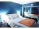 Comfortable bedroom featuring a plush bed, mirrored closet, and a cozy ambiance at 115 Parrish Ln, Las Vegas, NV 89110