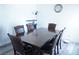 Dining area featuring a wooden table, matching chairs and wood flooring at 115 Parrish Ln, Las Vegas, NV 89110
