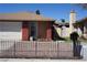 Charming single-story home featuring brick accents and a well-kept landscaped front yard at 115 Parrish Ln, Las Vegas, NV 89110
