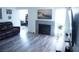 Inviting living room complete with a fireplace, large windows, and seamless flooring throughout at 115 Parrish Ln, Las Vegas, NV 89110