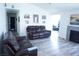 Spacious living room offering a cozy fireplace, recessed lighting, and lots of room to entertain at 115 Parrish Ln, Las Vegas, NV 89110