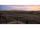 Balcony view showcasing a cityscape and distant mountain range at sunset at 1172 Monte De Luz Way, Henderson, NV 89012