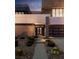 Contemporary two-story home with desert landscaping leading to a walkway and two-car garage at 1172 Monte De Luz Way, Henderson, NV 89012