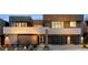 Contemporary two-story home with a desert landscaped front yard, walkway, and two-car garage at 1172 Monte De Luz Way, Henderson, NV 89012