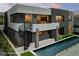 Modern home featuring a unique gray stucco exterior with a lap pool at 1172 Monte De Luz Way, Henderson, NV 89012