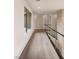 Hallway with wood floors, large windows and a metal cable railing at 1172 Monte De Luz Way, Henderson, NV 89012