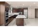 Kitchen featuring an island, modern appliances, and minimalist cabinet design for seamless cooking at 1172 Monte De Luz Way, Henderson, NV 89012