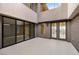 Spacious outdoor patio showcasing neutral tiling, multiple access points, and ample natural light at 1172 Monte De Luz Way, Henderson, NV 89012