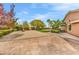 Paver patio with basketball court, desert landscaping, and a lush green lawn at 11730 Stonewall Springs Ave, Las Vegas, NV 89138