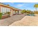 Backyard patio leading to a private pool and lush tropical landscaping at 11730 Stonewall Springs Ave, Las Vegas, NV 89138