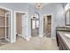 Bathroom featuring dual walk-in closets, chandelier and spacious vanity at 11730 Stonewall Springs Ave, Las Vegas, NV 89138
