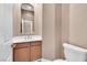 Cozy bathroom with wood cabinets and a white countertop sink at 11730 Stonewall Springs Ave, Las Vegas, NV 89138