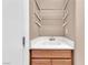 Bathroom vanity with wire rack shelving and ample counter space at 11730 Stonewall Springs Ave, Las Vegas, NV 89138