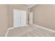 Neutral bedroom featuring a closet and a glimpse into an adjacent room at 11730 Stonewall Springs Ave, Las Vegas, NV 89138