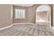 Serene bedroom with plush carpet, large window with plantation shutters, and crown molding at 11730 Stonewall Springs Ave, Las Vegas, NV 89138
