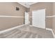 Bedroom with neutral walls, gray carpet, and a closet with sliding doors at 11730 Stonewall Springs Ave, Las Vegas, NV 89138