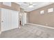 Bedroom with carpet, closet, ceiling fan, crown molding and neutral color palette at 11730 Stonewall Springs Ave, Las Vegas, NV 89138