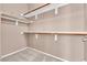 A well-organized walk-in closet with multiple shelves and racks at 11730 Stonewall Springs Ave, Las Vegas, NV 89138