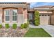 Charming home featuring manicured landscaping, a private courtyard, and a two-car garage at 11730 Stonewall Springs Ave, Las Vegas, NV 89138