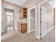 Hallway with built-in cabinets offering access to other rooms with neutral paint and flooring at 11730 Stonewall Springs Ave, Las Vegas, NV 89138