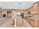 Open kitchen boasting granite countertops, stainless appliances, and seamless flow into the living area at 11730 Stonewall Springs Ave, Las Vegas, NV 89138