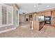 Kitchen and living room showcasing an open concept floor plan with stainless steel appliances at 11730 Stonewall Springs Ave, Las Vegas, NV 89138