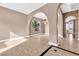 Spacious living room featuring tile floors, arched doorways, and ample natural light at 11730 Stonewall Springs Ave, Las Vegas, NV 89138