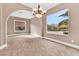 Inviting room featuring tile floors, arched entries, and large windows with views at 11730 Stonewall Springs Ave, Las Vegas, NV 89138