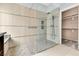 Luxurious shower with glass enclosure and unique tile accents at 11730 Stonewall Springs Ave, Las Vegas, NV 89138