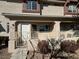 Charming two-story townhouse featuring a cozy front porch with railing and shade at 1308 Dusty Creek St, Las Vegas, NV 89128
