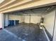 Spacious two-car garage featuring an open layout and essential utilities at 1308 Dusty Creek St, Las Vegas, NV 89128