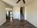 Open-concept living room with wood flooring leading to the kitchen and staircase at 1308 Dusty Creek St, Las Vegas, NV 89128