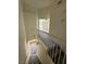 Carpeted staircase with a white railing leading to an upper level with views of the living spaces at 1308 Dusty Creek St, Las Vegas, NV 89128