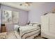 Charming bedroom with a bed, accent furniture, and a bright window offering ample natural light at 1375 Gran Vista Ave, Henderson, NV 89012