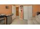 Cozy bedroom showcasing neutral walls, closet, a comfortable seating area, and tile flooring at 1375 Gran Vista Ave, Henderson, NV 89012
