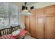 Charming breakfast nook featuring a glass table with natural light, and lots of wooden storage cabinets at 1375 Gran Vista Ave, Henderson, NV 89012