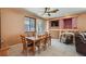 Comfortable dining room with wood table and chairs plus sliding doors to the back yard at 1375 Gran Vista Ave, Henderson, NV 89012