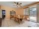 Comfortable dining room with wood table and chairs plus sliding doors to the back yard at 1375 Gran Vista Ave, Henderson, NV 89012