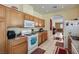Functional kitchen with lots of cabinet space, granite countertops, and white appliances at 1375 Gran Vista Ave, Henderson, NV 89012