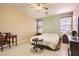 This main bedroom with tile floors, desk, and ensuite bath access is the perfect place to relax at 1375 Gran Vista Ave, Henderson, NV 89012