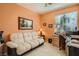 Office space with a comfortable sofa, desk, and bright natural light at 1375 Gran Vista Ave, Henderson, NV 89012