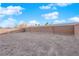 Large, expansive backyard space surrounded by a tall block wall with space for landscaping and custom design at 1909 Pinsky Ln, North Las Vegas, NV 89032