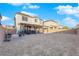 Home's outdoor living space with a covered patio, space for dining, and a large backyard ready for customization at 1909 Pinsky Ln, North Las Vegas, NV 89032